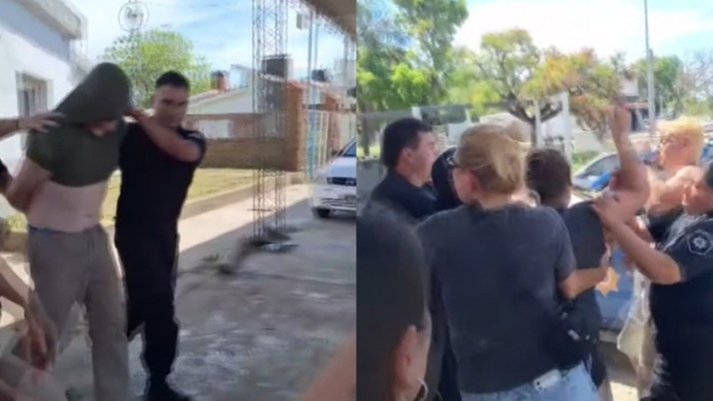 La salida del portero detenido y los padres intentando increparlo.